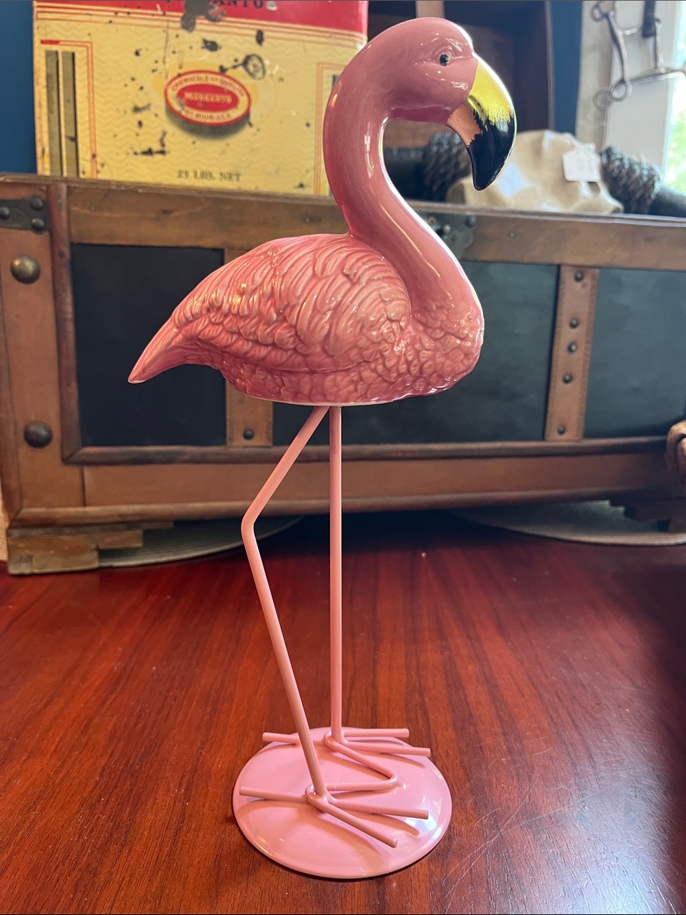 Glossy pink flamingo tabletop figurine featuring a striking black-and-gold beak